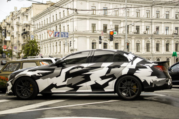 Sedan wrapped in a black and white camo vinyl design