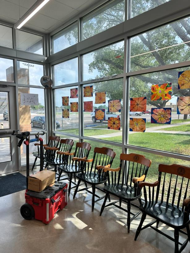 Close-up of chairs against a wall of windows in a school in in Harris County, Texas.